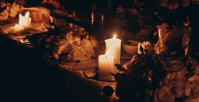candle light and decor. candles burning on golden candlestick