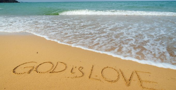 God is love on the sea shore.