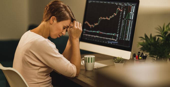 Woman Experiencing Stress During A Late Night Analyzing Crypto Graph From Home