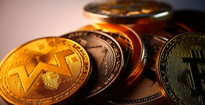Closeup of monero, bitcoin, and other cryptocurrencies golden coins