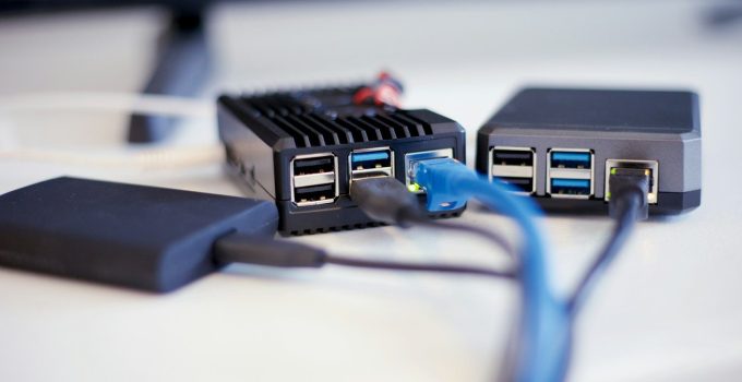 black and blue usb cable with small electronic devices