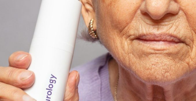 woman holding Curology bottle
